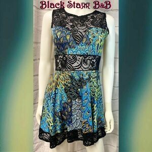 Black w/blue yellow lime peacock print sleeveless mini dress. Sz Md